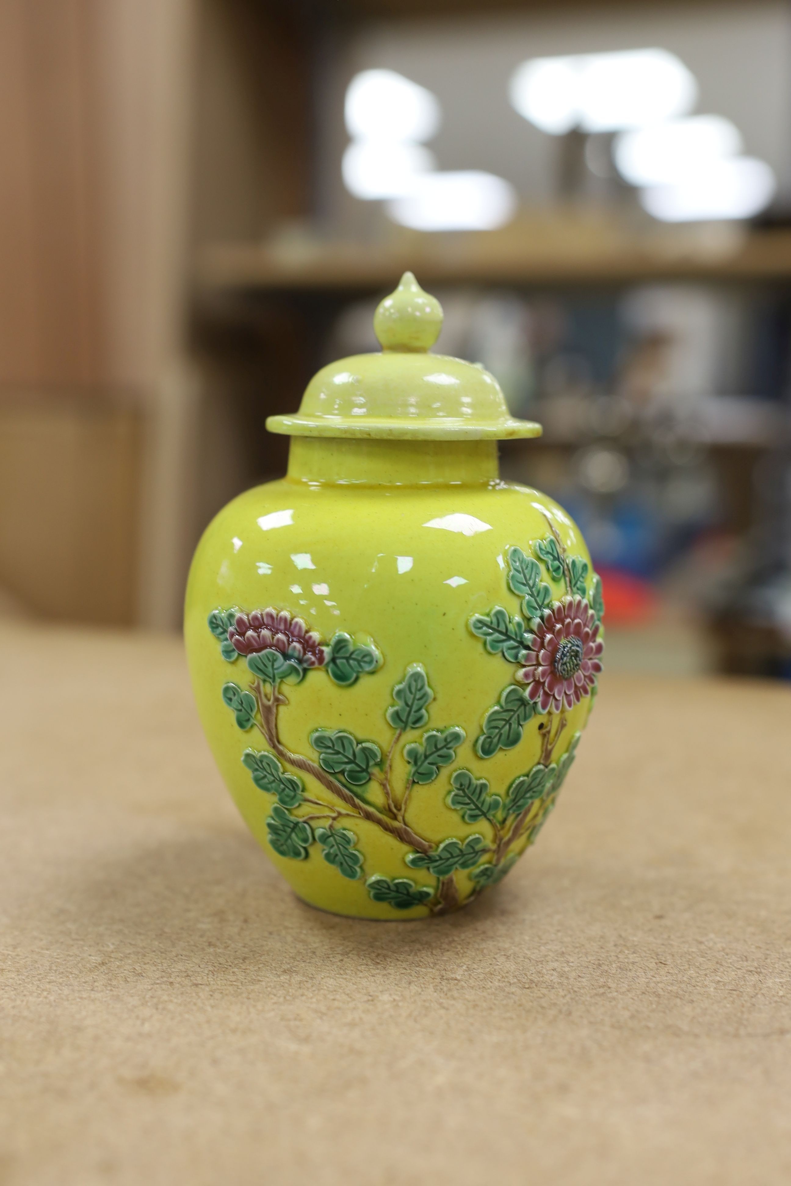 A Chinese enamelled yellow-ground jar and cover, a pottery teapot and cover and a flambe vase, latter 13cm